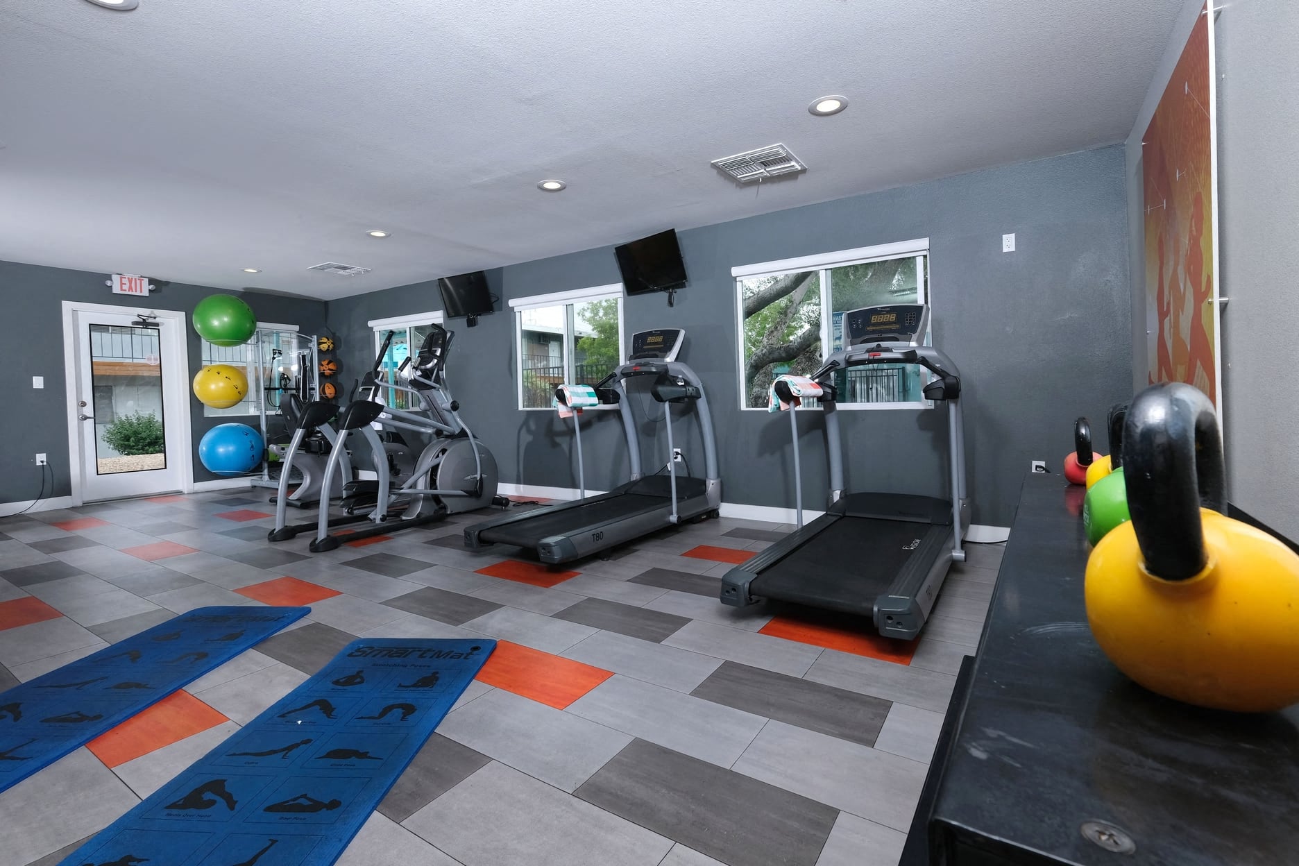 Fifteen 50 apartments near Las Vegas strip on site gym with treadmills, ellipticals, yoga mats, exercise balls, and dumbbell weights.